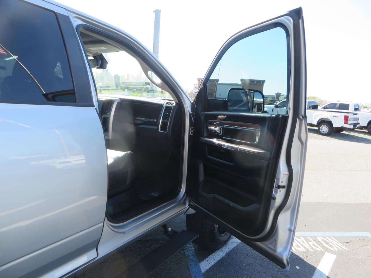 2016 SILVER /BLACK RAM 2500 Laramie Crew Cab SWB 4WD (3C6UR5FL3GG) with an 6.7L L6 OHV 24V TURBO DIESEL engine, 6A transmission, located at 2630 Grass Valley Highway, Auburn, CA, 95603, (530) 508-5100, 38.937893, -121.095482 - Leveled Ram sitting on Fuel Offroad wheels, Falken Wildpeak AT tires, Amp Power steps, Rolling Bed cover, Color matched fender flares, and window tint. - Photo#42